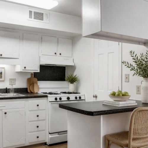 a kitchen with white cabinets