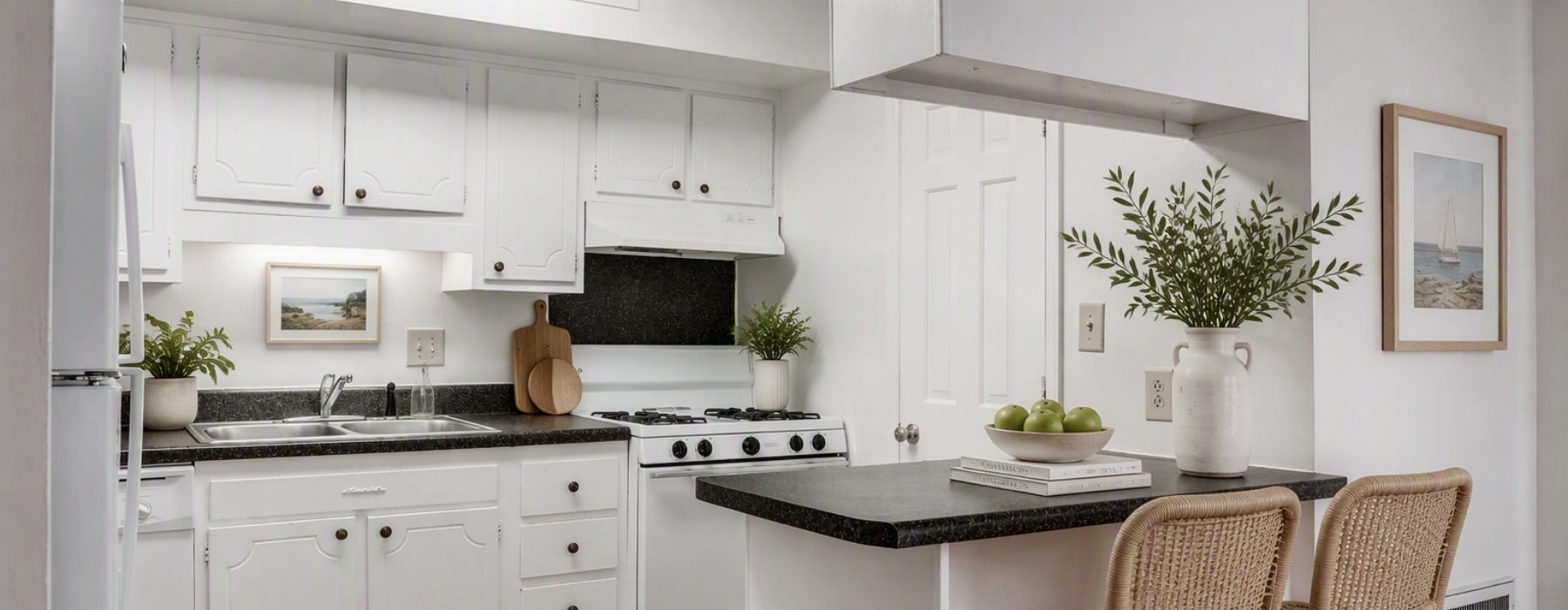 a kitchen with white cabinets